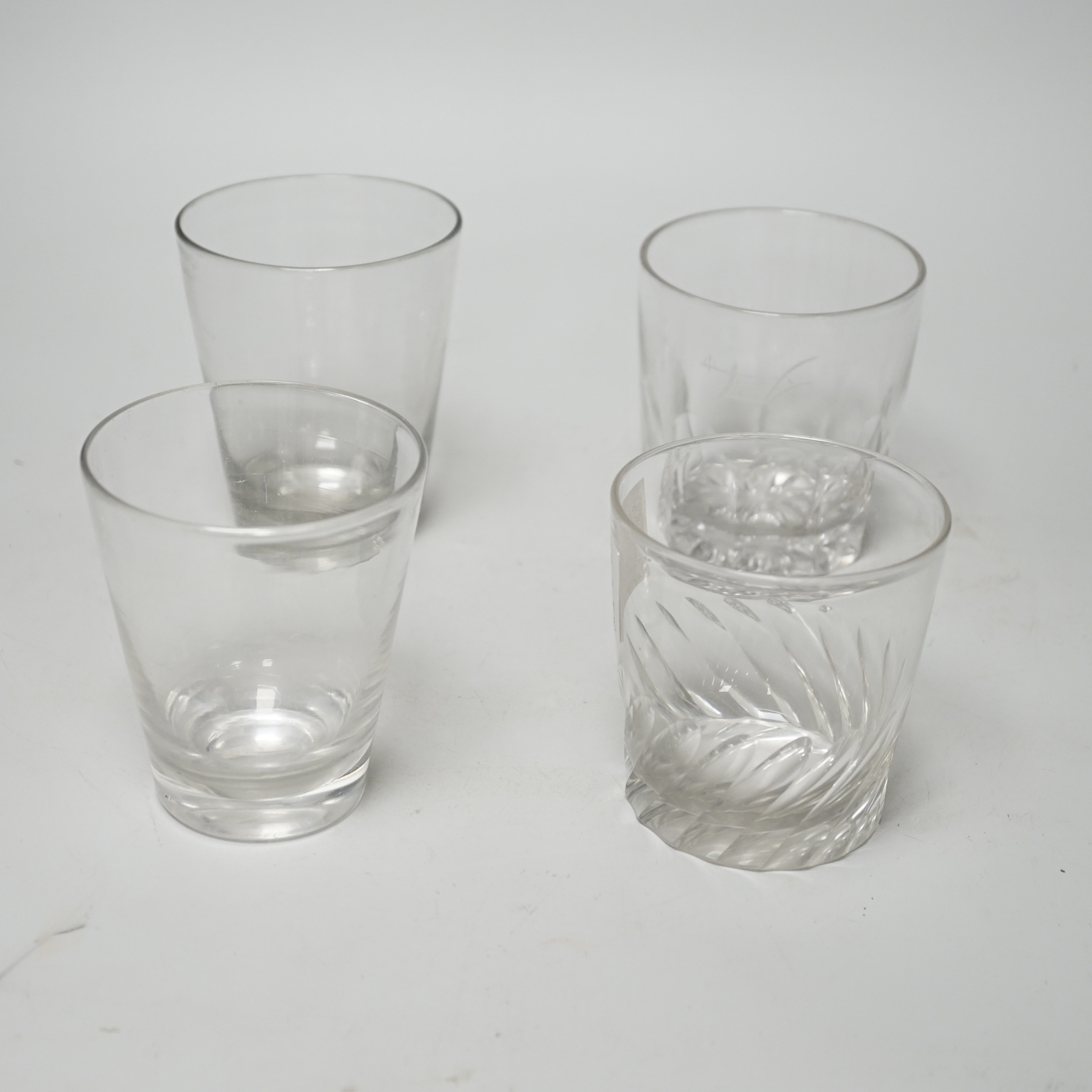 Four Georgian English lead crystal tumblers, one earlier example c.1770, with rare, wide, ground and polished pontil area, 11.5cm high
